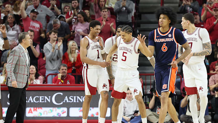 Feb 14, 2026; Fayetteville, Arkansas, USA; Arkansas Razorbacks guards Mellek Thomas (1) and Darius Acuff Jr (5) celebrate after a play in the second half against the Auburn Tigers at Bud Walton Arena. Mandatory Credit: Nelson Chenault-Imagn Images