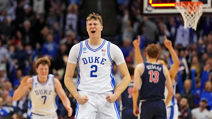Mar 27, 2025; Newark, NJ, USA; Duke Blue Devils forward Cooper Flagg (2) reacts after making a last second shot to end the first half against the Arizona Wildcats during an East Regional semifinal of the 2025 NCAA tournament at Prudential Center. Mandatory Credit: Robert Deutsch-Imagn Images