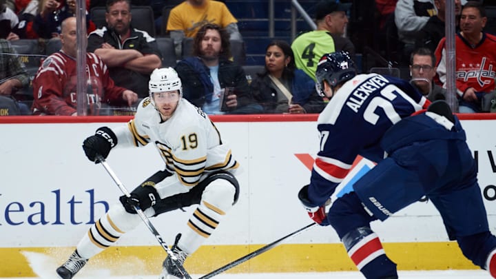 Mar 30, 2024; Washington, District of Columbia, USA; Boston Bruins center John Beecher (19) has control of the puck against the Washington Capitals during the second period at Capital One Arena. Mandatory Credit: Hannah Foslien-USA TODAY Sports