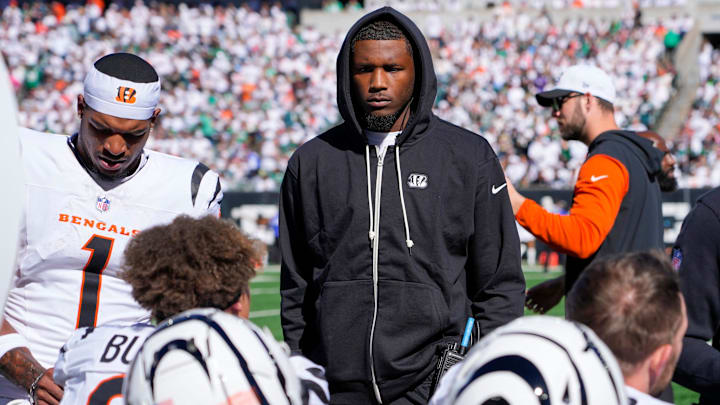 Cincinnati Bengals wide receiver Ja'Marr Chase (1) and injured Cincinnati Bengals wide receiver Tee Higgins talk with their teammates during the NFL Week 8 matchup against Philadelphia Eagles at Paycor Stadium Sunday October 27, 2024. The Bengals lost 37-17 and remain winless at home.