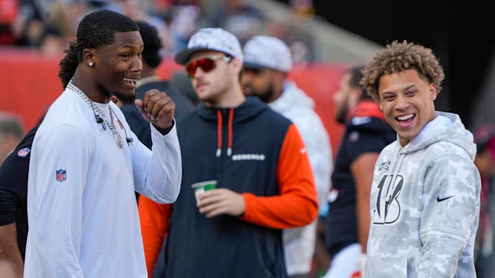 Cincinnati Bengals wide receiver Tee Higgins (5) talks with wide receiver Jermaine Burton (81) as the Bengals take on the Las Vegas Raiders at Paycor Stadium Sunday, November 3, 2024.