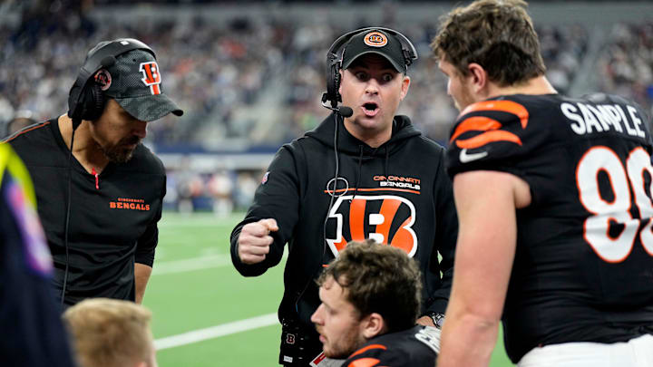 Cincinnati Bengals head coach Zac Taylor talks with tight end Drew Sample (89) and other players as they take on Dallas Cowboys Monday Night Football at AT&T Stadium in Arlington,Texas on Monday, December 9, 2024.