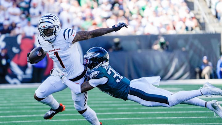 Cincinnati Bengals wide receiver Ja'Marr Chase (1) tries to break free from Philadelphia Eagles cornerback Isaiah Rodgers (34) at Paycor Stadium Sunday October 27, 2024. The Bengals lost 37-17 and remain winless at home.