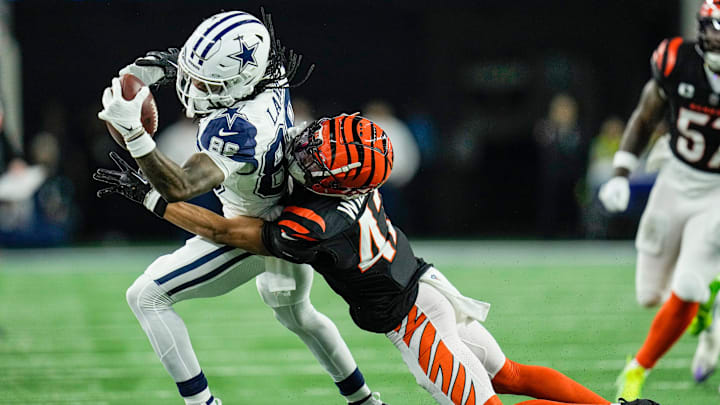 Cincinnati Bengals cornerback Marco Wilson (42) stops Dallas Cowboys wide receiver CeeDee Lamb (88) in the first quarter of Monday Night Football at AT&T Stadium in Arlington,Texas on Monday, December 9, 2024. Cincinnati Bengals cornerback Marco Wilson (42) stops Dallas Cowboys wide receiver CeeDee Lamb (88) in the first quarter of Monday Night Football at AT&T Stadium in Arlington,Texas on Monday, December 9, 2024.