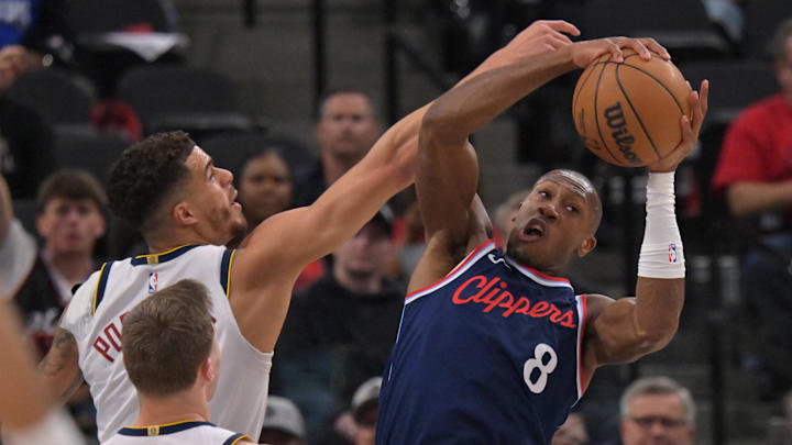 Apr 26, 2025; Inglewood, California, USA; Denver Nuggets forward Michael Porter Jr. (1) defends Los Angeles Clippers guard Kris Dunn (8) in the first half of game four of round one of the 2024 NBA Playoffs at Intuit Dome. Mandatory Credit: Jayne Kamin-Oncea-Imagn Images