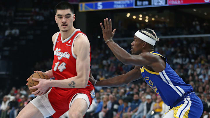 Memphis Grizzlies center Zach Edey (14) drives to the basket as Golden State Warriors forward Jimmy Butler III (10) defends Memphis Grizzlies center Zach Edey (14) drives to the basket as Golden State Warriors forward Jimmy Butler III (10) defends