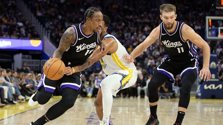 Oct 11, 2024; San Francisco, California, USA; Sacramento Kings guard DeMar DeRozan (10) drives past Golden State Warriors forward Kyle Anderson (1) during the second quarter at Chase Center. Mandatory Credit: D. Ross Cameron-Imagn Images