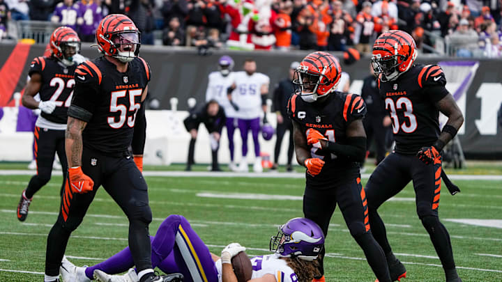 Cincinnati Bengals linebacker Logan Wilson (55) and cornerback Mike Hilton (21) and safety Nick