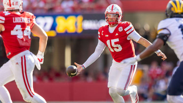 Nebraska quarterback Dylan Raiola flips the ball to tight end Luke Lindenmeyer during the third quarter against Michigan. Nebraska quarterback Dylan Raiola flips the ball to tight end Luke Lindenmeyer during the third quarter against Michigan.
