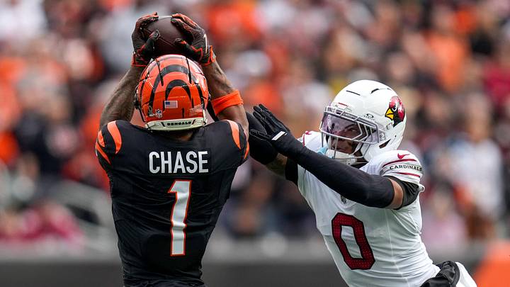 Cincinnati Bengals wide receiver Ja'Marr Chase (1) catches a pass over Arizona Cardinals cornerback Will Johnson (0) in the first quarter of the NFL Week 17 game between the Cincinnati Bengals and the Arizona Cardinals at Paycor Stadium in Downtown Cincinnati on Sunday, Dec. 28, 2025. The Bengals led 23-7 at halftime. Cincinnati Bengals wide receiver Ja'Marr Chase (1) catches a pass over Arizona Cardinals cornerback Will Johnson (0) in the first quarter of the NFL Week 17 game between the Cincinnati Bengals and the Arizona Cardinals at Paycor Stadium in Downtown Cincinnati on Sunday, Dec. 28, 2025. The Bengals led 23-7 at halftime.