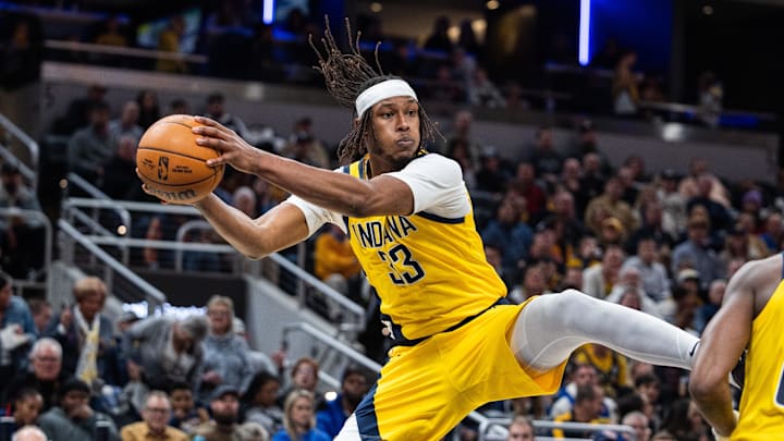 Jan 18, 2025; Indianapolis, Indiana, USA; Indiana Pacers center Myles Turner (33) rebounds the ball in the second half against the Philadelphia 76ers at Gainbridge Fieldhouse. Mandatory Credit: Trevor Ruszkowski-Imagn Images