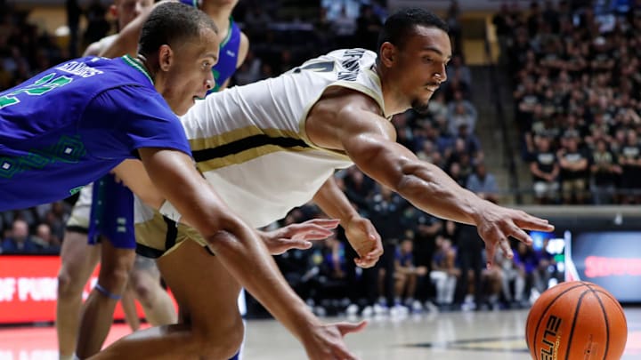 Texas AM-CC& Islanders forward Owen Dease (12) and Purdue Boilermakers forward Trey Kaufman-Renn (4) 