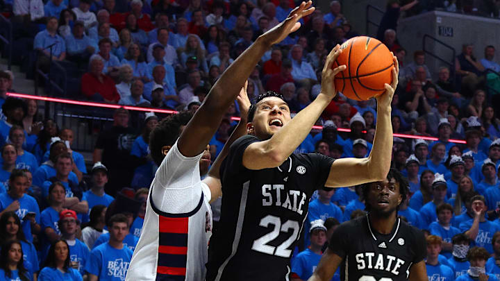 Feb 15, 2025; Oxford, Mississippi, USA; Mississippi State Bulldogs forward RJ Melendez (22) shoots as Mississippi Rebels forward Malik Dia (0) defends during the first half at The Sandy and John Black Pavilion at Ole Miss. Mandatory Credit: Petre Thomas-Imagn Images