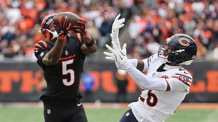 Nov 2, 2025; Cincinnati, Ohio, USA; Cincinnati Bengals wide receiver Tee Higgins (5) catches a 44-yard touchdown pass thrown by quarterback Joe Flacco (not pictured) against Chicago Bears cornerback Nahshon Wright (26) during the second quarter at Paycor Stadium. Mandatory Credit: Joseph Maiorana-Imagn Images Nov 2, 2025; Cincinnati, Ohio, USA; Cincinnati Bengals wide receiver Tee Higgins (5) catches a 44-yard touchdown pass thrown by quarterback Joe Flacco (not pictured) against Chicago Bears cornerback Nahshon Wright (26) during the second quarter at Paycor Stadium. Mandatory Credit: Joseph Maiorana-Imagn Images