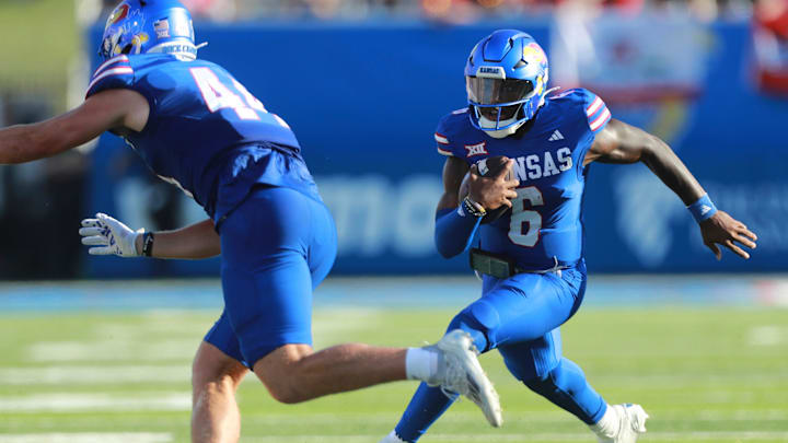 Kansas Jayhawks quarterback Jalon Daniels (6) runs the ball during the game between Fresno State and Kansas at David Booth Kansas Memorial Stadium on Aug. 23, 2025.