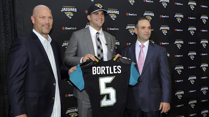 May 9, 2014; Jacksonville, FL, USA; Jacksonville Jaguars head coach Gus Bradley poses with Blake Bortles (Central Florida) and Jaguars general manager David Caldwell after addressing the media at the Upper West Touchdown Club at EverBank Field a day after being selected as the third overall pick in the first round of the 2014 NFL draft by the Jacksonville Jaguars.  Mandatory Credit: John David Mercer-Imagn Images