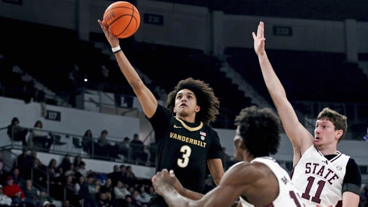 Jan 24, 2026; Starkville, Mississippi, USA; Vanderbilt Commodores guard Tyler Tanner (3) shoots as Mississippi State Bulldogs forward Sergej Macura (11) defends during the first half at Humphrey Coliseum.