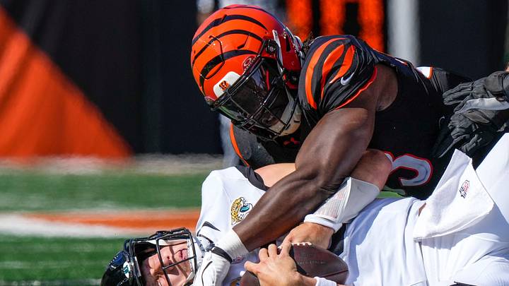 Jacksonville Jaguars quarterback Trevor Lawrence (16) is sacked by Cincinnati Bengals defensive end Boye Mafe (53) in the third quarter of the NFL Week 4 game between the Cincinnati Bengals and the Jacksonville Jaguars at Paycor Stadium in Cincinnati on Sunday, Oct. 4, 2026. The Bengals fell to 2-2 on the season with a 22-17 loss at home.