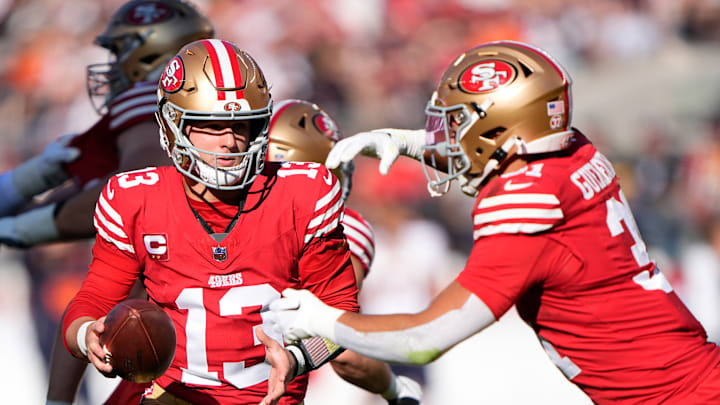 San Francisco 49ers quarterback Brock Purdy (L) and running back Jordan Mason (R)
