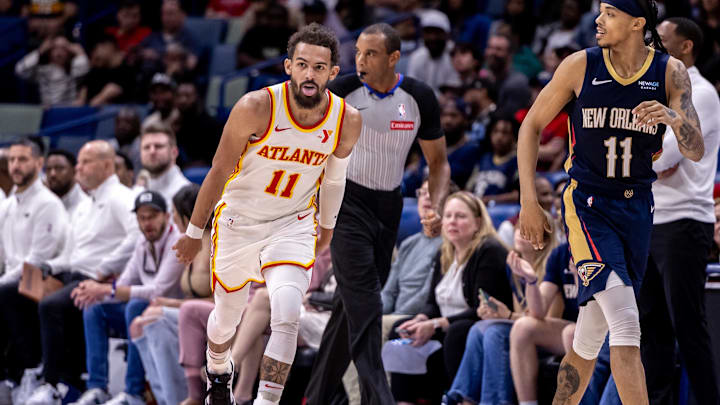 Nov 3, 2024; New Orleans, Louisiana, USA;  Atlanta Hawks guard Trae Young (11) reacts to making a three point basket against the New Orleans Pelicans during the second half at Smoothie King Center. Mandatory Credit: Stephen Lew-Imagn Images