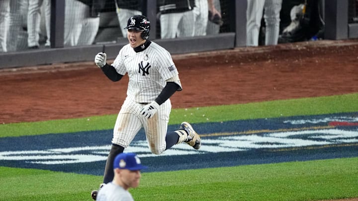 Oct 29, 2024; Bronx, New York, USA; New York Yankees shortstop Anthony Volpe (11) reacts after hitting a grand slam against the Los Angeles Dodgers in the third inning during Game 4 of the 2024 MLB World Series at Yankee Stadium.