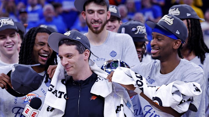 May 28, 2025; Oklahoma City, Oklahoma, USA; Oklahoma City Thunder head coach Mark Daigneault celebrates with his team after defeating the Minnesota Timberwolves in game five to win the western conference finals for the 2025 NBA Playoffs at Paycom Center. Mandatory Credit: Alonzo Adams-Imagn Images