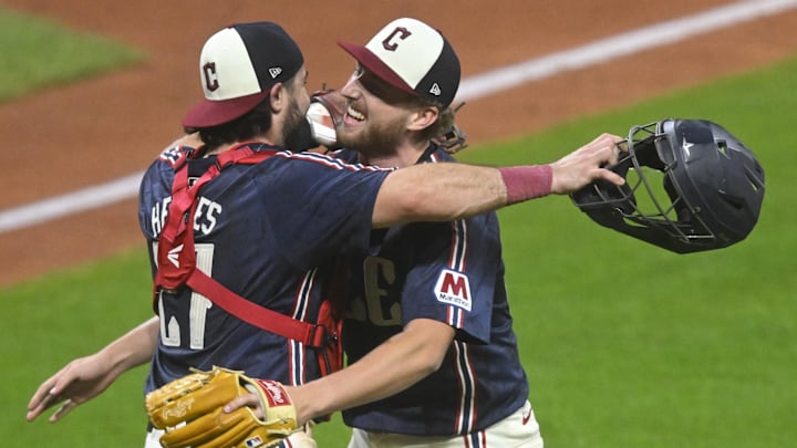 Sep 12, 2025; Cleveland, Ohio, USA; Cleveland Guardians catcher Austin Hedges (27) and starting pitcher Tanner Bibee (28) celebrate a win over the Chicago White Sox at Progressive Field. Mandatory Credit: David Richard-Imagn Images