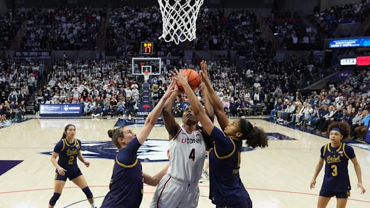 Jan 19, 2026; Storrs, Connecticut, USA; Notre Dame Fighting Irish forward Gisela Sanchez (30) and guard Cassandre Prosper (8) defend against UConn Huskies guard Blanca Quinonez (4) in the second half at Harry A. Gampel Pavilion. Mandatory Credit: David Butler II-Imagn Images