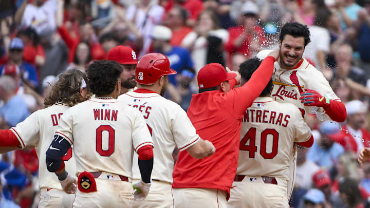 Jun 7, 2025; St. Louis, Missouri, USA; St. Louis Cardinals pinch hitter Nolan Arenado (28) is lifted up by first baseman Willson Contreras (40) and mobbed by teammates after hitting a walk-off one run single against the Los Angeles Dodgers during the ninth inning at Busch Stadium. Mandatory Credit: Jeff Curry-Imagn Images Jun 7, 2025; St. Louis, Missouri, USA; St. Louis Cardinals pinch hitter Nolan Arenado (28) is lifted up by first baseman Willson Contreras (40) and mobbed by teammates after hitting a walk-off one run single against the Los Angeles Dodgers during the ninth inning at Busch Stadium. Mandatory Credit: Jeff Curry-Imagn Images