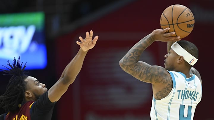 Ex-Husky Isaiah Thomas takes a shot for Charlotte against Cleveland in a 2022 NBA game. 