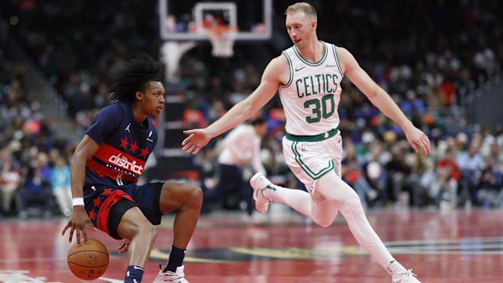 Nov 22, 2024; Washington, District of Columbia, USA; Washington Wizards guard Bub Carrington (8) dribbles the ball as Boston Celtics forward Sam Hauser (30) defends in the second half at Capital One Arena. Mandatory Credit: Geoff Burke-Imagn Images