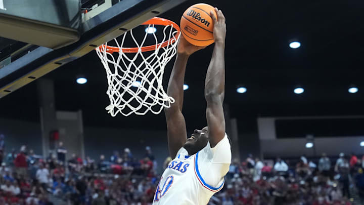 Mar 22, 2026; San Diego, CA, USA; Kansas Jayhawks forward Flory Bidunga (40) dunks against the St. John's Red Storm in the second half during a second round game of the men's 2026 NCAA Tournament at Viejas Arena.