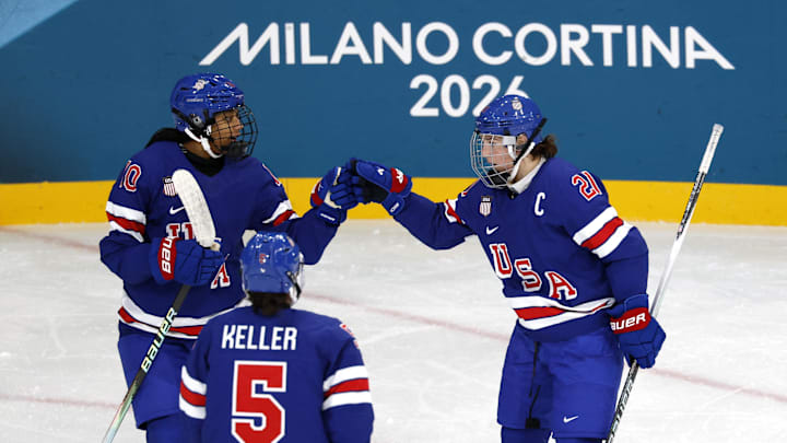 Feb 7, 2026; Milan, Italy; Hilary Knight (21) of the United States celebrates with Laila Edwards (10) of the United States after scoring a goal against Finland  in women's ice hockey group A play during the Milano Cortina 2026 Olympic Winter Games at Milano Rho Ice Hockey Arena. Mandatory Credit: David W Cerny/Reuters via Imagn Images