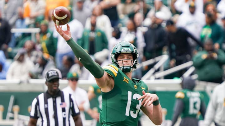 Nov 1, 2025; Waco, Texas, USA; Baylor Bears quarterback Sawyer Robertson (13) throws downfield against the UCF Knights during the first half at McLane Stadium. Mandatory Credit: Raymond Carlin III-Imagn Images