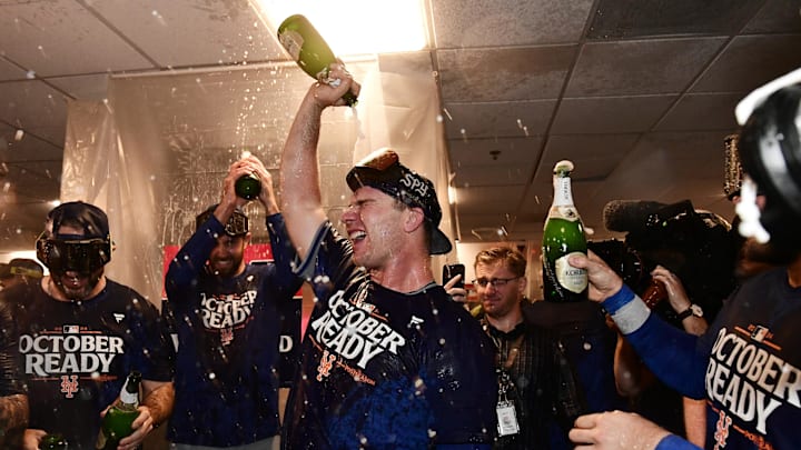 Oct 3, 2024; Milwaukee, Wisconsin, USA; New York Mets first baseman Pete Alonso (20) celebrates with teammates in the clubhouse after defeating the Milwaukee Brewers in game three of the Wildcard round for the 2024 MLB Playoffs at American Family Field. Mandatory Credit: Benny Sieu-Imagn Images