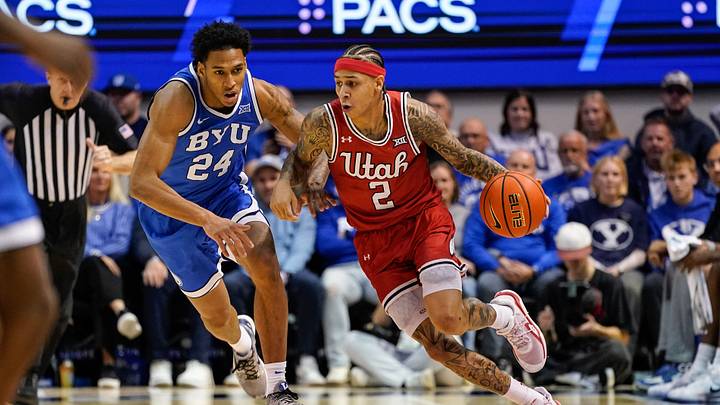 Jan 24, 2026; Provo, Utah, USA; Utah Utes guard Terrence Brown (2) controls the ball while being defended by BYU Cougars forward Dominique Diomande (24) during the second half at Marriott Center. Mandatory Credit: Aaron Baker-Imagn Images Jan 24, 2026; Provo, Utah, USA; Utah Utes guard Terrence Brown (2) controls the ball while being defended by BYU Cougars forward Dominique Diomande (24) during the second half at Marriott Center. Mandatory Credit: Aaron Baker-Imagn Images