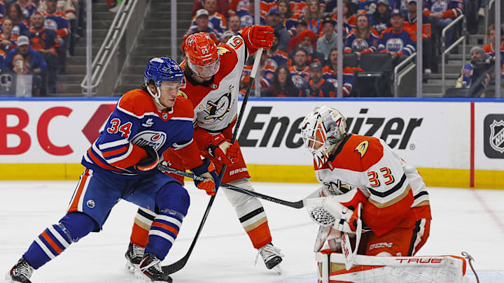 Apr 28, 2026; Edmonton, Alberta, CAN;Edmonton Oilers forward Colton Dach (34) looks for a loose puck in front of Anaheim Ducks goaltender Ville Husso (33) during the third period in game five of the first round of the 2026 Stanley Cup Playoffs at Rogers Place. Mandatory Credit: Perry Nelson-Imagn Images