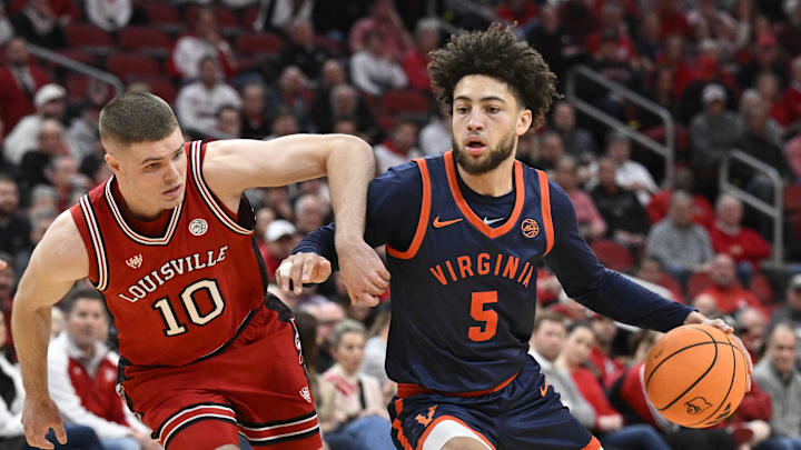 Jan 13, 2026; Louisville, Kentucky, USA; Virginia Cavaliers guard Sam Lewis (5) dribbles against Louisville Cardinals guard Isaac McKneely (10) during the first half at KFC Yum! Center. Mandatory Credit: Jamie Rhodes-Imagn Images Jan 13, 2026; Louisville, Kentucky, USA; Virginia Cavaliers guard Sam Lewis (5) dribbles against Louisville Cardinals guard Isaac McKneely (10) during the first half at KFC Yum! Center. Mandatory Credit: Jamie Rhodes-Imagn Images