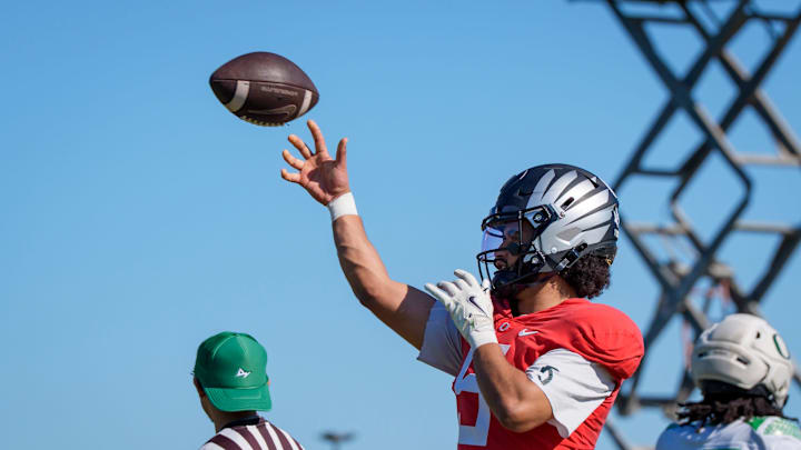 One highly regarded passer is weighing a tough call on entering the NFL and his team connections could matter.