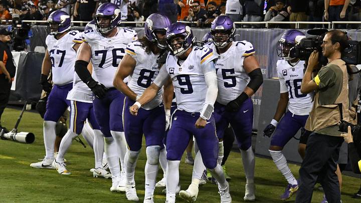 Sep 8, 2025; Chicago, Illinois, USA; Minnesota Vikings quarterback J.J. McCarthy (9) reacts after scoring a touchdown against the Chicago Bears during the second half at Soldier Field. Mandatory Credit: Matt Marton-Imagn Images