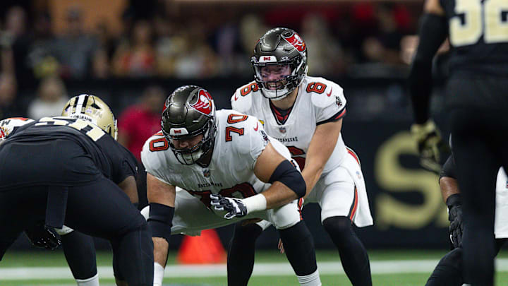 Oct 13, 2024; New Orleans, Louisiana, USA;  Tampa Bay Buccaneers quarterback Baker Mayfield (6) calls for the ball from center Robert Hainsey (70) against the New Orleans Saints during he first half at Caesars Superdome. Mandatory Credit: Stephen Lew-Imagn Images