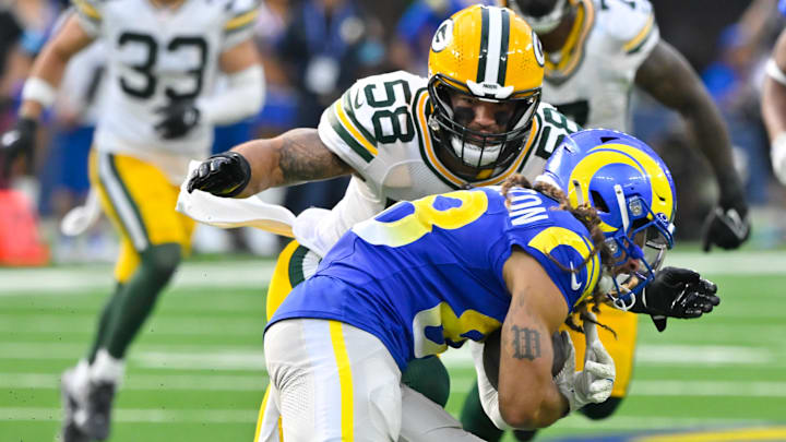 Oct 6, 2024; Inglewood, California, USA; Green Bay Packers linebacker Isaiah McDuffie (58) corrals Los Angeles Rams wide receiver Jordan Whittington (88) during the third quarter at SoFi Stadium. Mandatory Credit: Robert Hanashiro-Imagn Images