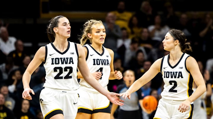 Iowa guards Caitlin Clark, left, Kylie Feuerbach and Taylor McCabe celebrate during a NCAA women's basketball game against Drake, Sunday, Nov. 19, 2023, at Carver-Hawkeye Arena in Iowa City, Iowa.