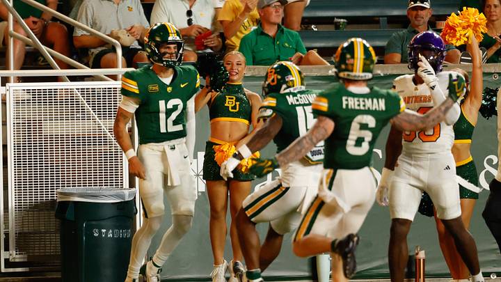 Sep 12, 2026; Waco, Texas, USA; Baylor Bears quarterback Nate Bennett (12) celebrates with teammates after scoring a touchdown against the Prairie View A&M Panthers during the first half at McLane Stadium. Mandatory Credit: Chris Jones-Imagn Images Sep 12, 2026; Waco, Texas, USA; Baylor Bears quarterback Nate Bennett (12) celebrates with teammates after scoring a touchdown against the Prairie View A&M Panthers during the first half at McLane Stadium. Mandatory Credit: Chris Jones-Imagn Images