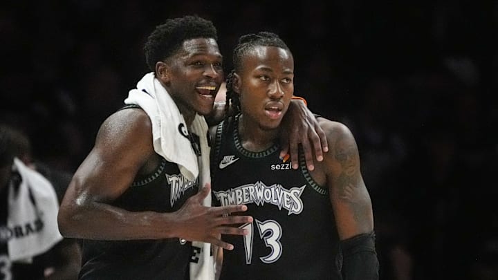 Apr 23, 2026; Minneapolis, Minnesota, USA; Minnesota Timberwolves guard Anthony Edwards (5) talks with guard Ayo Dosunmu (13) during a free throw by the Denver Nuggets in the first quarter at Target Center. Mandatory Credit: Bruce Kluckhohn-Imagn Images