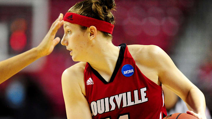 Mar 19, 2012; College Park, MD, USA; Louisville Cardinals guard Becky Burke (11) controls the ball during the second half of the game against the Maryland Terrapins in the second round of the 2012 NCAA women's basketball tournament at Comcast Center.  Mandatory Credit: Evan Habeeb-Imagn Images
