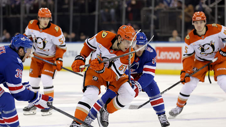 Dec 15, 2025; New York, New York, USA; Anaheim Ducks left wing Cutter Gauthier (61) fights for the puck against New York Rangers center Sam Carrick (39) and right wing Taylor Raddysh (14) during the third period at Madison Square Garden. Mandatory Credit: Brad Penner-Imagn Images Dec 15, 2025; New York, New York, USA; Anaheim Ducks left wing Cutter Gauthier (61) fights for the puck against New York Rangers center Sam Carrick (39) and right wing Taylor Raddysh (14) during the third period at Madison Square Garden. Mandatory Credit: Brad Penner-Imagn Images
