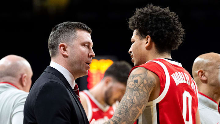 Ohio State head coach Jake Diebler talks to Ohio State guard John Mobley Jr. (0) during a timeout while playing against the Iowa Hawkeyes Feb. 25, 2026 at Carver-Hawkeye Arena in Iowa City, Iowa.