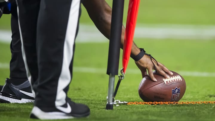 Oct 28, 2021; Glendale, Arizona, USA; Detailed view as NFL referee measures the football for a first down with yard markers during the Arizona Cardinals game against the Green Bay Packers at State Farm Stadium. Oct 28, 2021; Glendale, Arizona, USA; Detailed view as NFL referee measures the football for a first down with yard markers during the Arizona Cardinals game against the Green Bay Packers at State Farm Stadium.
