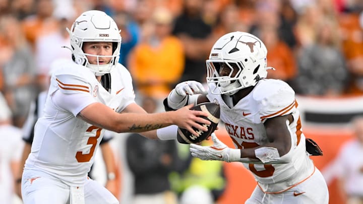 Oct 26, 2024; Nashville, Tennessee, USA;  Texas Longhorns quarterback Quinn Ewers (3) hands the ball off to running back Quintrevion Wisner (26) against the Vanderbilt Commodores during the second half at FirstBank Stadium. Mandatory Credit: Steve Roberts-Imagn Images